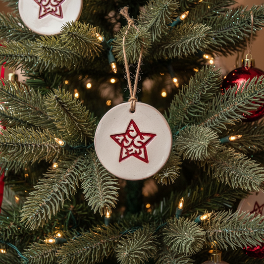 Round ceramic ornament with engraved star
