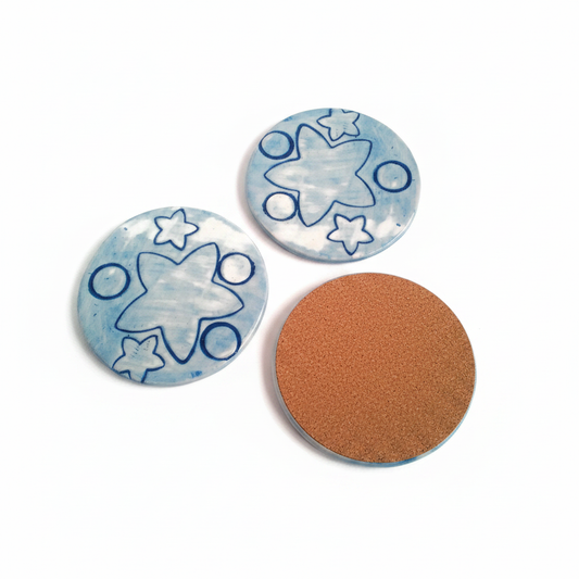 Set of three blue handmade ceramic coasters