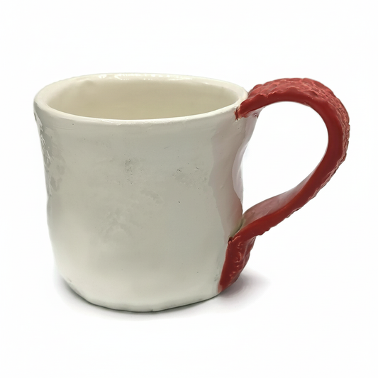 Handmade red and white ceramic mug