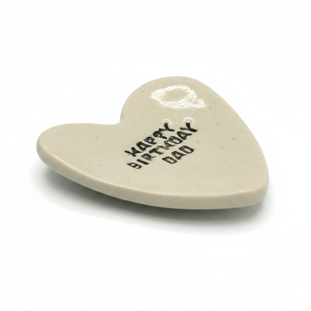 Handmade beige ceramic heart dish reading Happy Birthday Dad
