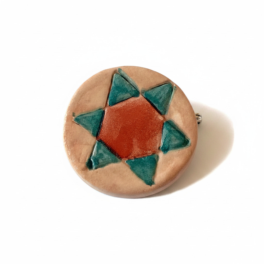 Handmade red and green ceramic star brooch