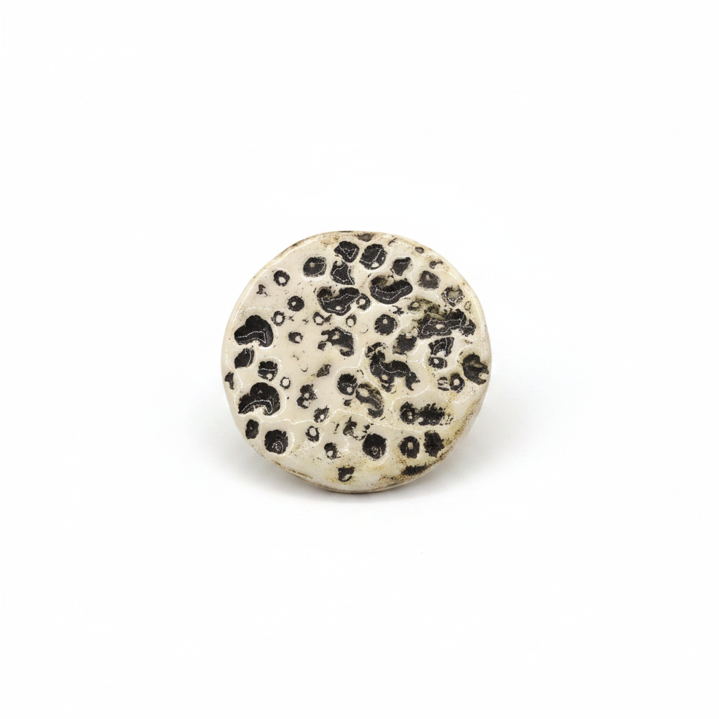 Handmade beige ceramic moon brooch with textured full-moon design
