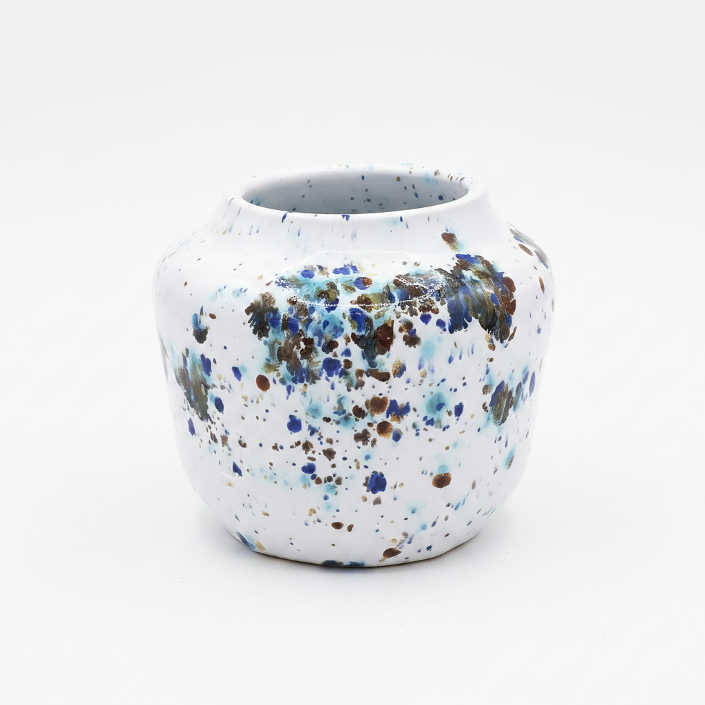 Handmade speckled ceramic bud vase on white background