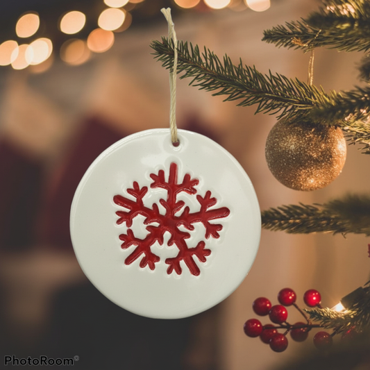 Handmade red ceramic snowflake ornament in winter home decor